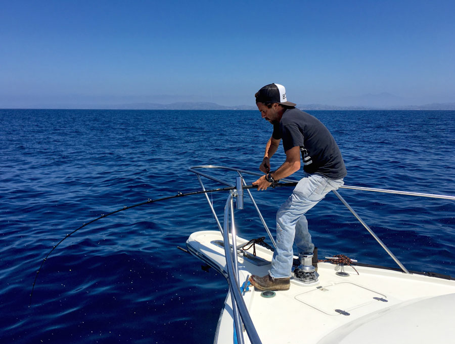 Capt. Ben Knight pinned to the bow of Bongos III, just a few miles outside of Dana Point.